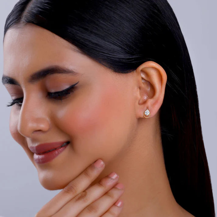 gold solitaire teardrop studs