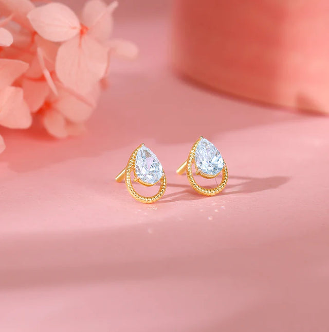 Gold Solitaire Teardrop Studs