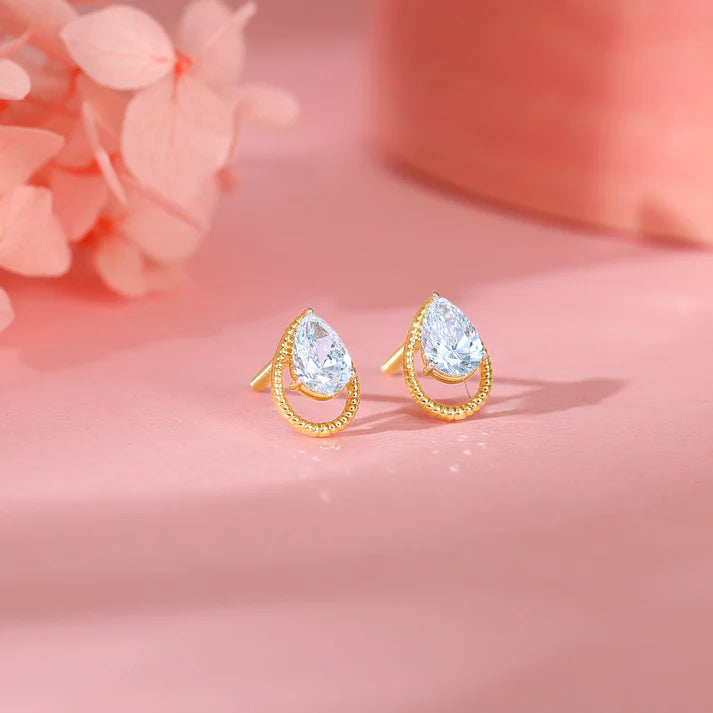 gold solitaire teardrop studs