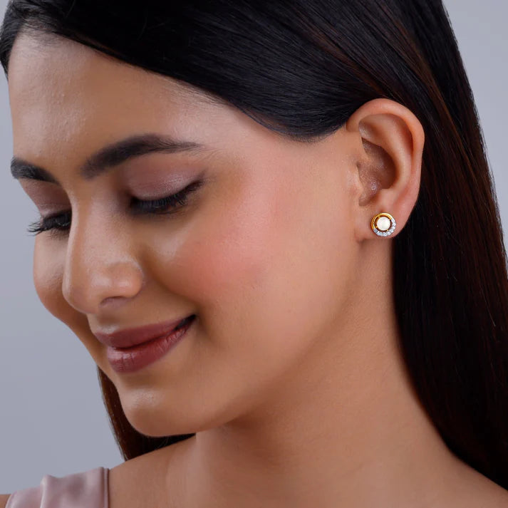 gold pearl centred diamond earrings